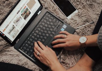 laptop in bed - benefits of starting an online business